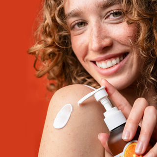By Nature Skincare model with Vitamin C face and body moisturiser