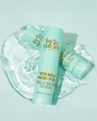 Serum stick brand By nature with 'Vitamin E + Aloe Vera' on a light blue background